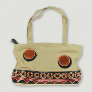 Bolso lona con parches en piel. Pequeño