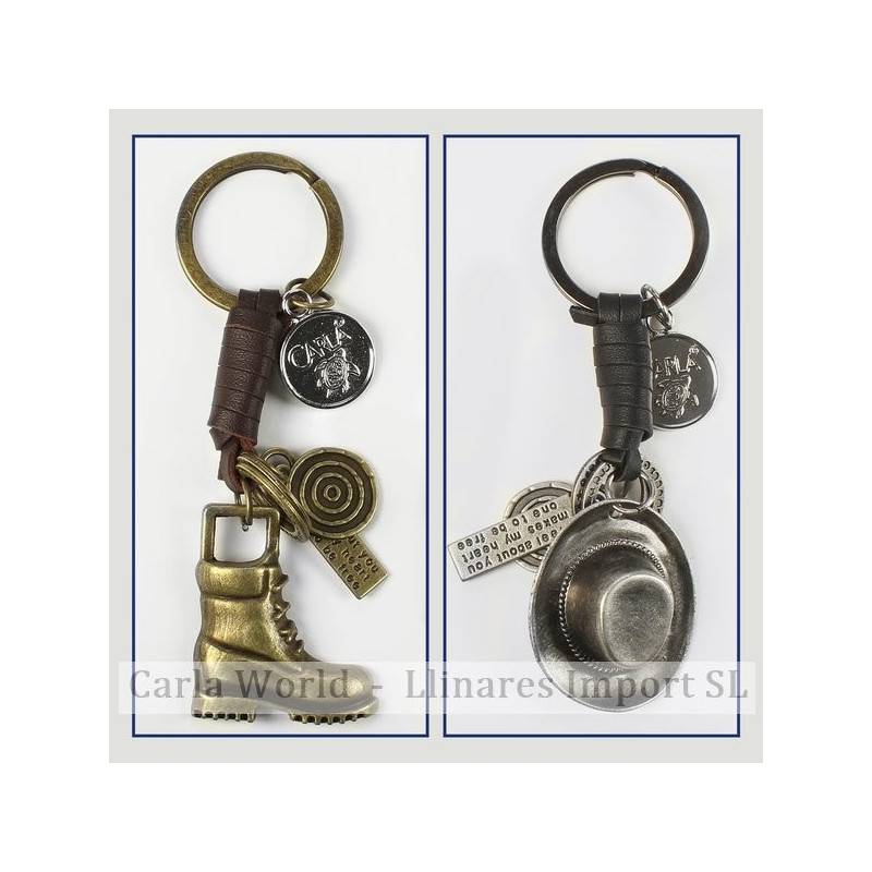 Gancho 36 – Llavero metal dorado/plateado con cuero. Modelo Bota y Sombrero vaquero surtidos Gancho 36 – Llavero metal dorado/plateado con cuero. Modelo Bota y Sombrero vaquero surtidos