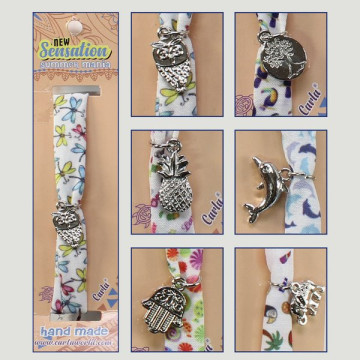 Gancho 28 - Pulsera tela. Modelo variado. 