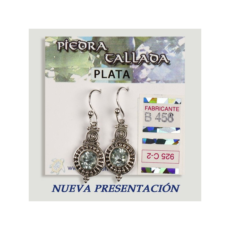 Boucles d'oreilles en argent. Topaze bleue sculptée. Forme de cercle. Boucles d'oreilles en argent. Topaze bleue sculptée. Forme de cercle.