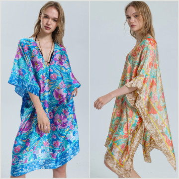 100% Polyester poncho, silky finish. V-shaped neck. One size fits all - 2 colors