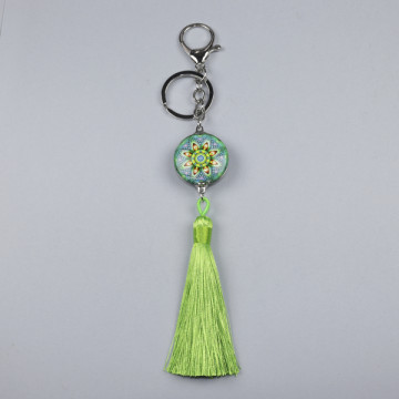 Hook 99 Keychain with varied character and pompom