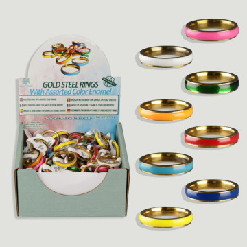 Display of golden steel rings with assorted colored enamel