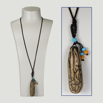 Pendant with cord. Yupati