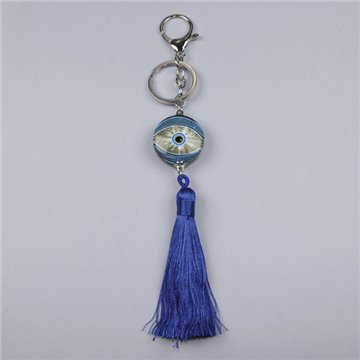 Pom-pom keychain. Navy blue eye