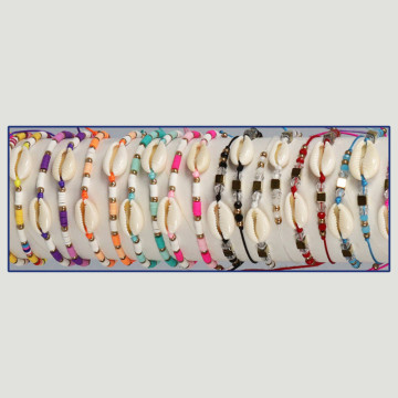 Pulsera Verano. Cypraea + entrepiezas doradas. Surtidos