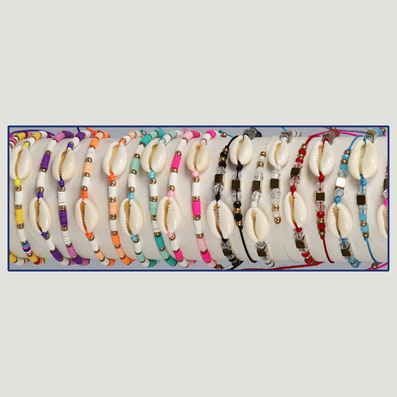 Bracelet Été. Cypraea + Intercalaires plaqués or. Assortiment Bracelet Été. Cypraea + Intercalaires plaqués or. Assortiment
