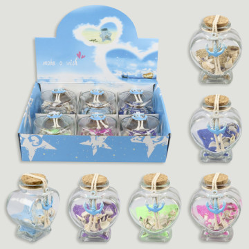 Botella arena con conchas. Modelo corazón. 6x4x8cm.